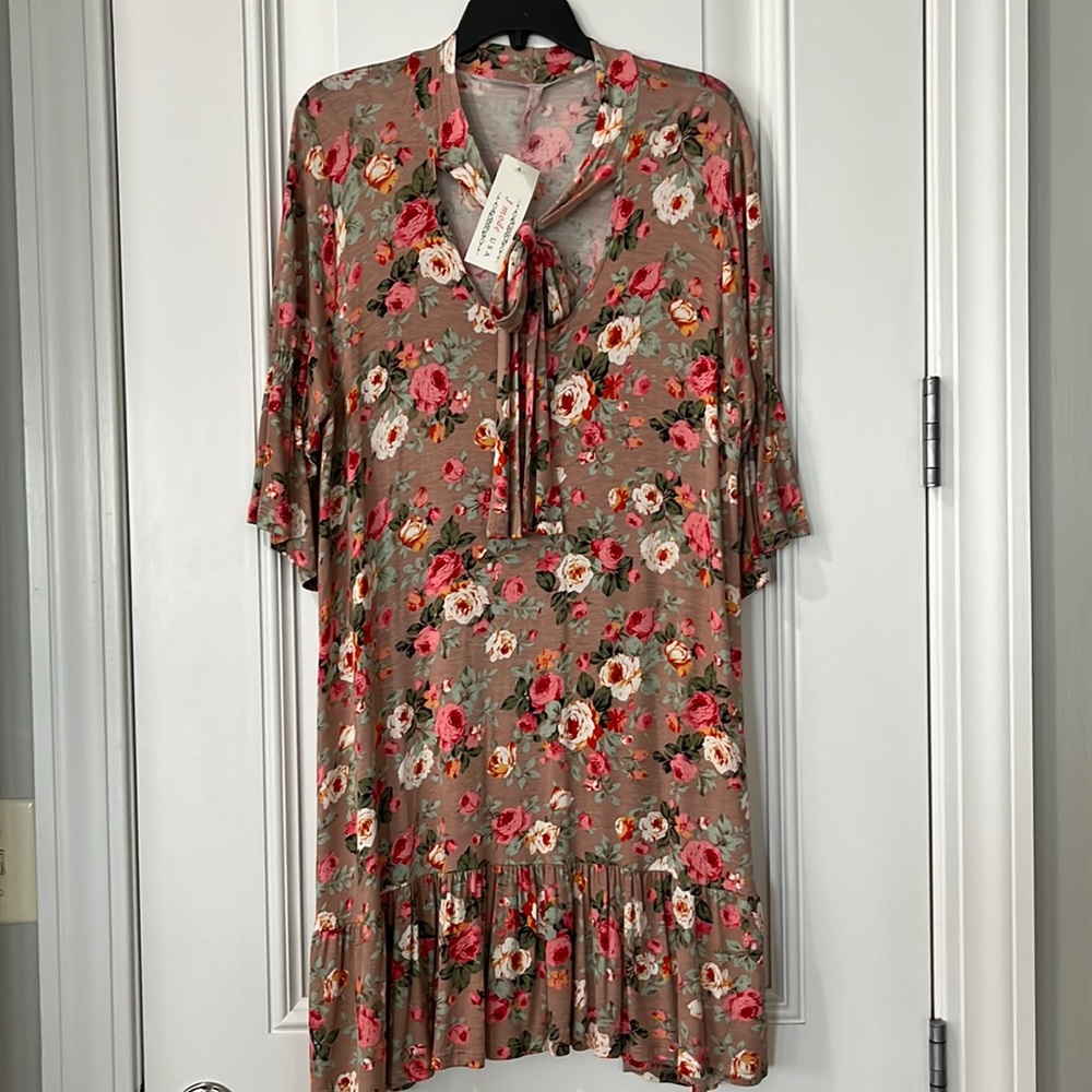 Floral Drop Waist Dress. 3/4 length ruffled sleeve.